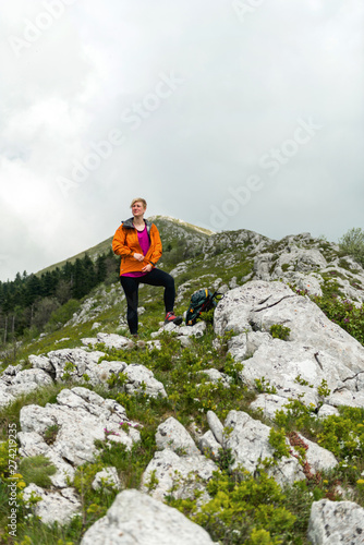 Woman Hiking alone in the mountains 