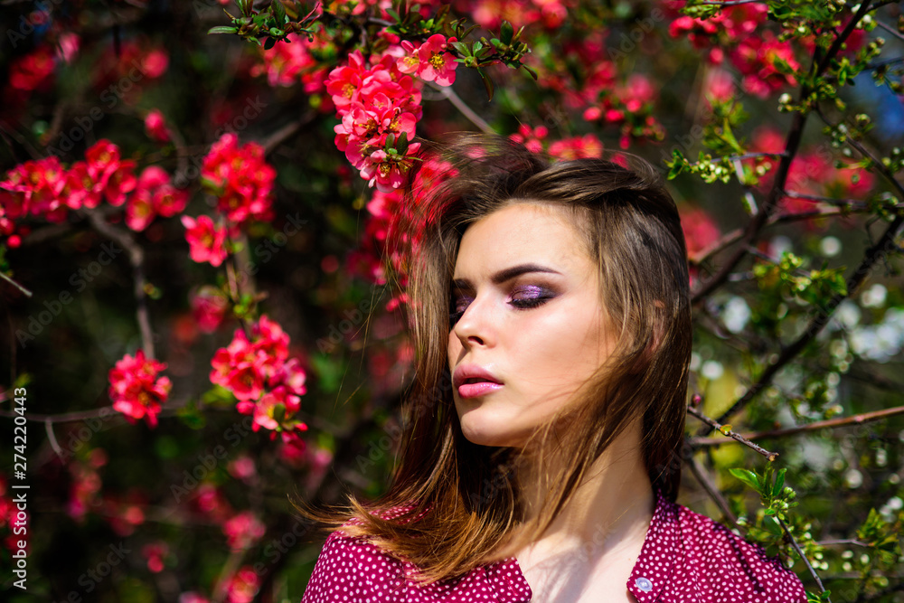 Naklejka premium Girl in harmony with nature. Natural environment organic cosmetics. Spring freshness. Blooming trees flowers. Natural beauty. Pretty woman skincare. Natural cosmetics concept. Makeup skin care