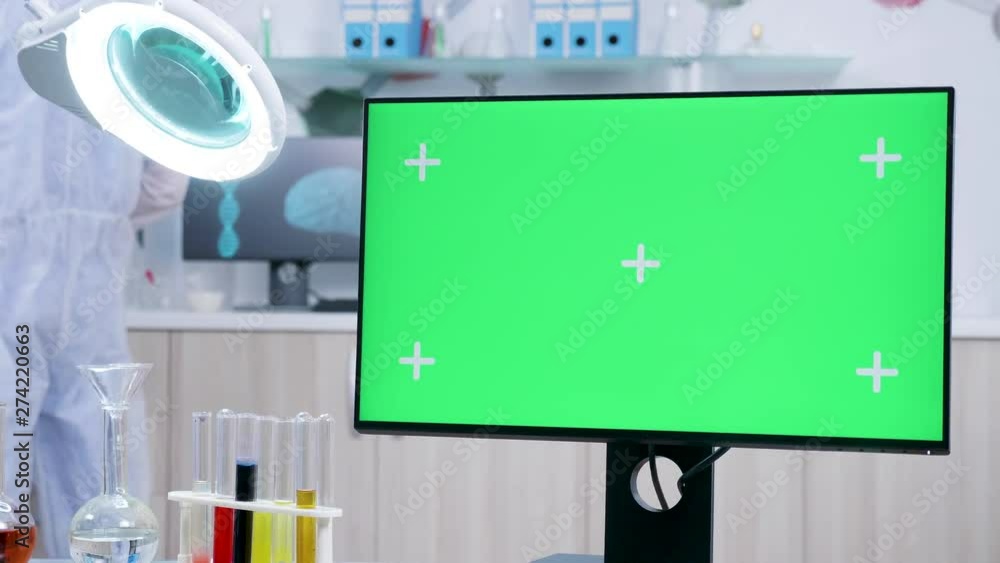 Close up shot of green screen mock-up in secure laboratory. Scientist ...