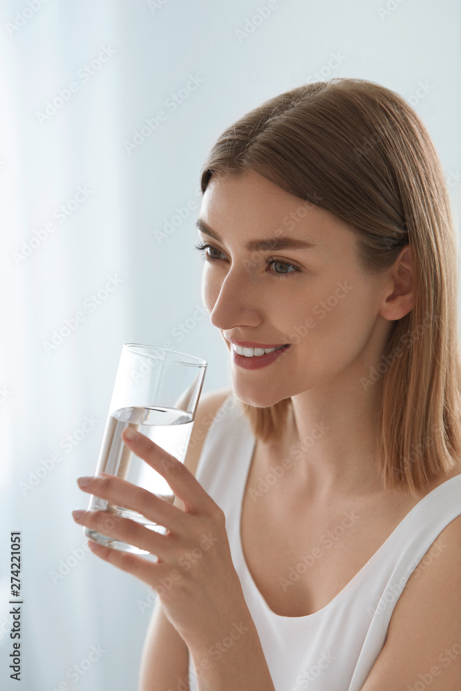 Drink. Woman drinking fresh pure water from glass portrait Drink. Woman drinking fresh pure water from glass portrait