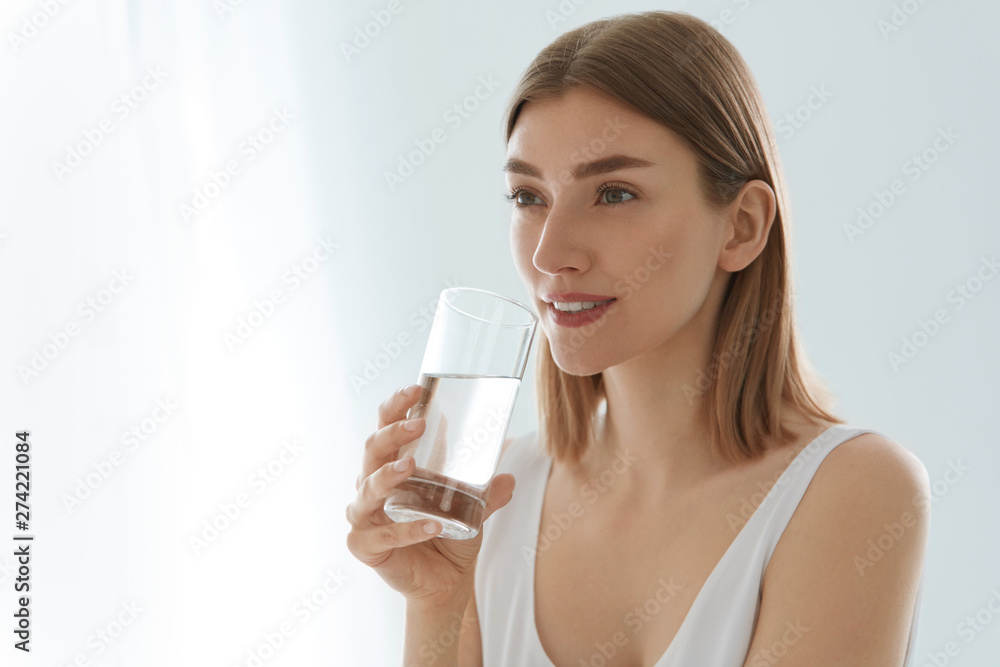 Drink. Woman drinking fresh pure water from glass portrait Drink. Woman drinking fresh pure water from glass portrait