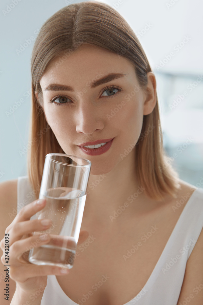 Drink. Woman drinking fresh pure water from glass portrait Drink. Woman drinking fresh pure water from glass portrait