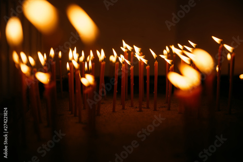 Close-up of candles in a church photo