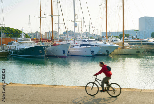 Man riding bicycle Barcelona Port