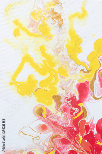 Fire and gold. Primary colors are red, yellow, gold on a white background. Acrylic paint, abstraction. Closeup picture. Colorful abstract painting background. Modern abstract painting.