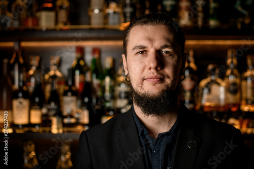 Portrait of adult male bartender in bar