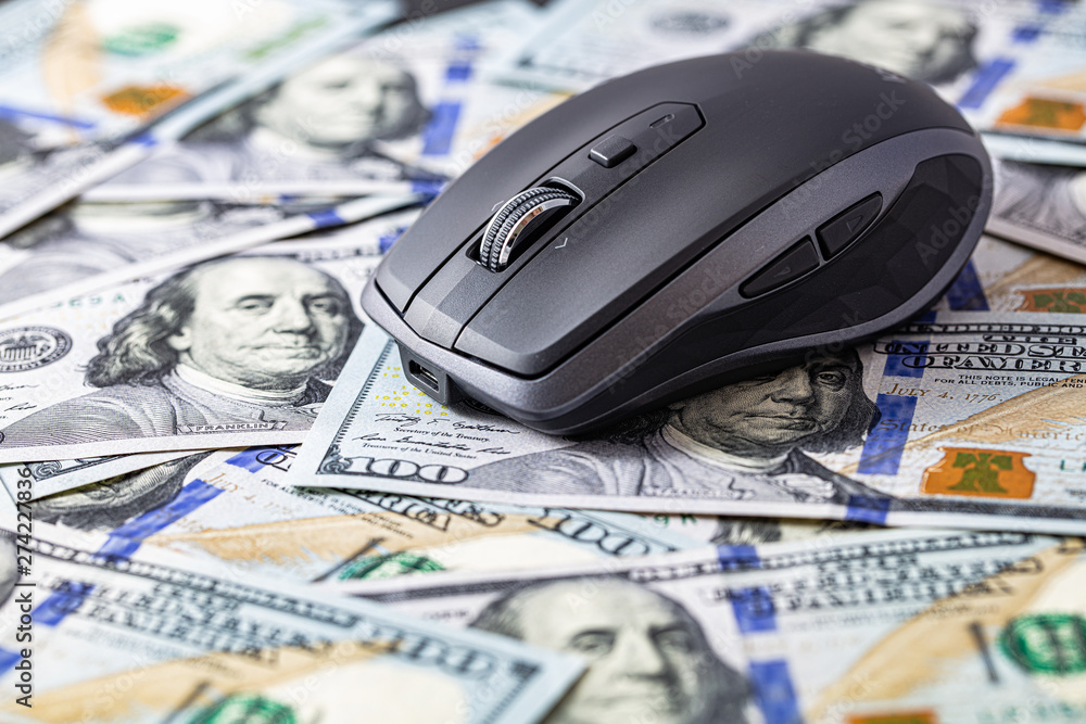 Wireless mobile mouse on 100 dollar background Wireless mobile mouse on 100 dollar background