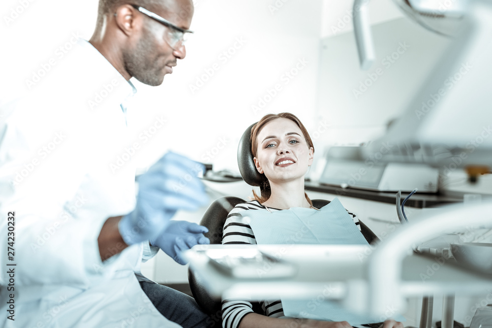 Attractive smiling woman having problem with her teeth Attractive smiling woman having problem with her teeth
