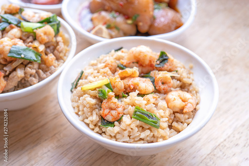 Braised shrimp over rice - Taiwan famous traditional street food. Soy-stewed prawn on cooked rice. Travel concept, top view, copy space, close up