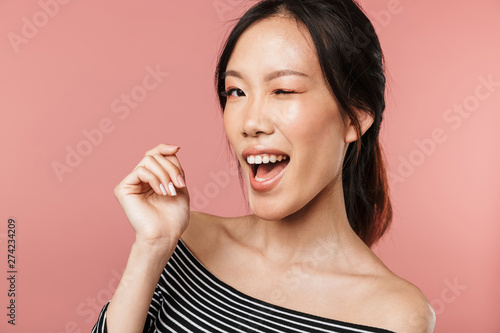 Portrait of a lovely young asian woman standing