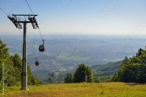 Overhead cable cars at lower station of cableway on Pohorje in Maribor, Slovenia, Mariborsko Pohorje ski slopes are popular hiking destination in summer