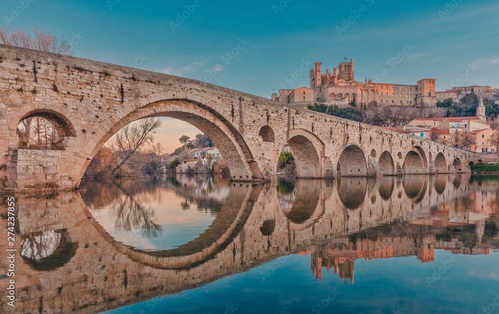 Béziers in south france during sunrise with reflections