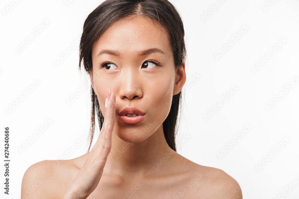 Shocked asian young pretty woman with healthy skin posing isolated over white wall background. Shocked asian young pretty woman with healthy skin posing isolated over white wall background.