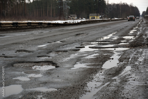 broken road, potholes, puddles, bad russian highway