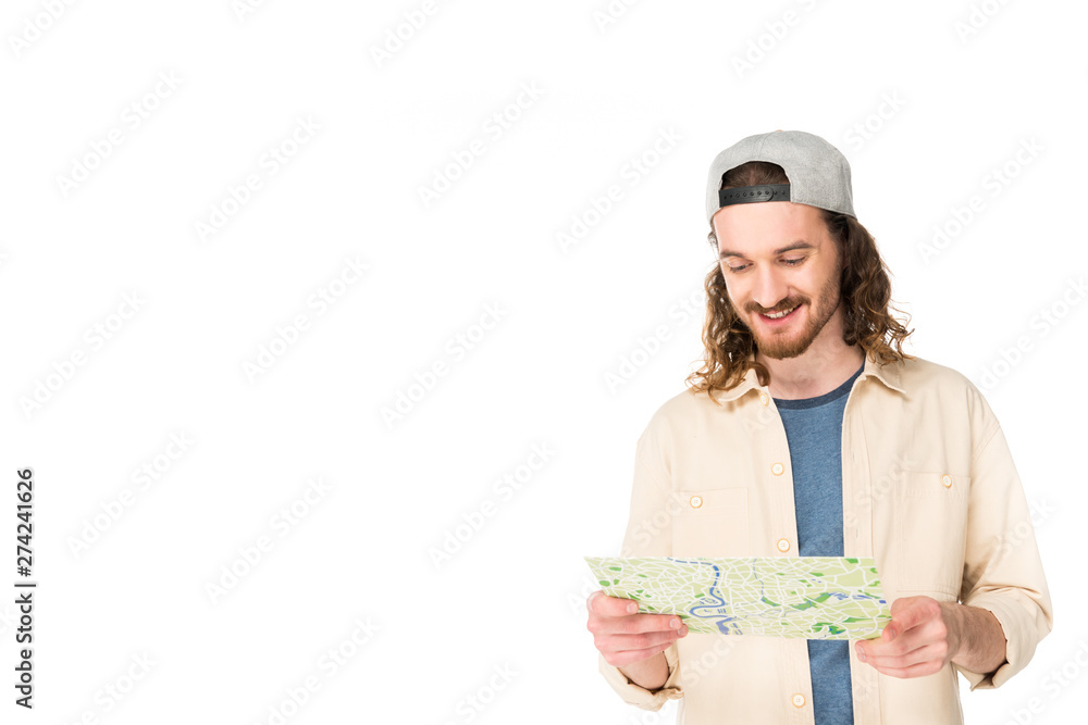 young man looking at map and smiling isolated on white young man looking at map and smiling isolated on white