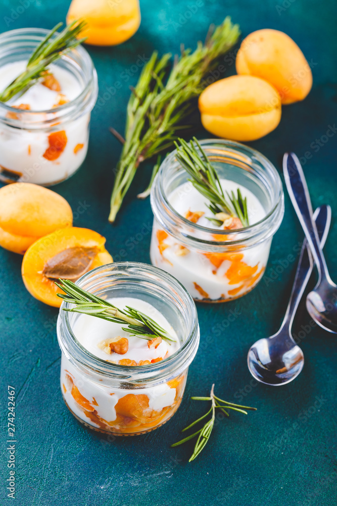 Natural yogurt with pieces of apricots and rosemary Natural yogurt with pieces of apricots and rosemary