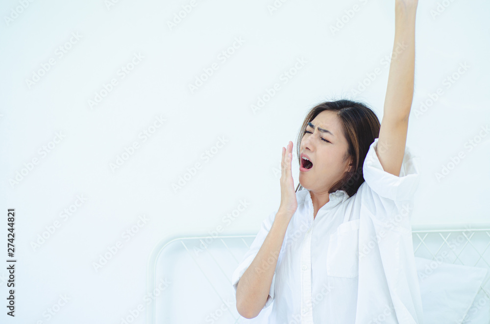 women sit at the edge of the bed. women sit at the edge of the bed.