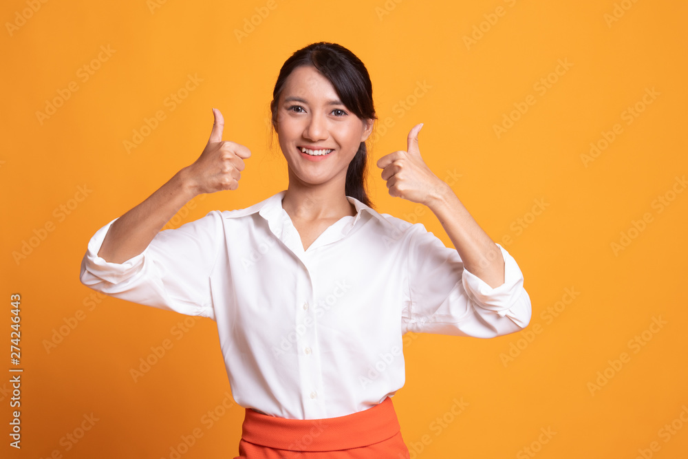 Young Asian woman show two thumbs up. Young Asian woman show two thumbs up.