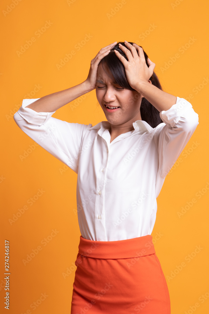 Stressed young Asian businesswoman scream out. Stressed young Asian businesswoman scream out.