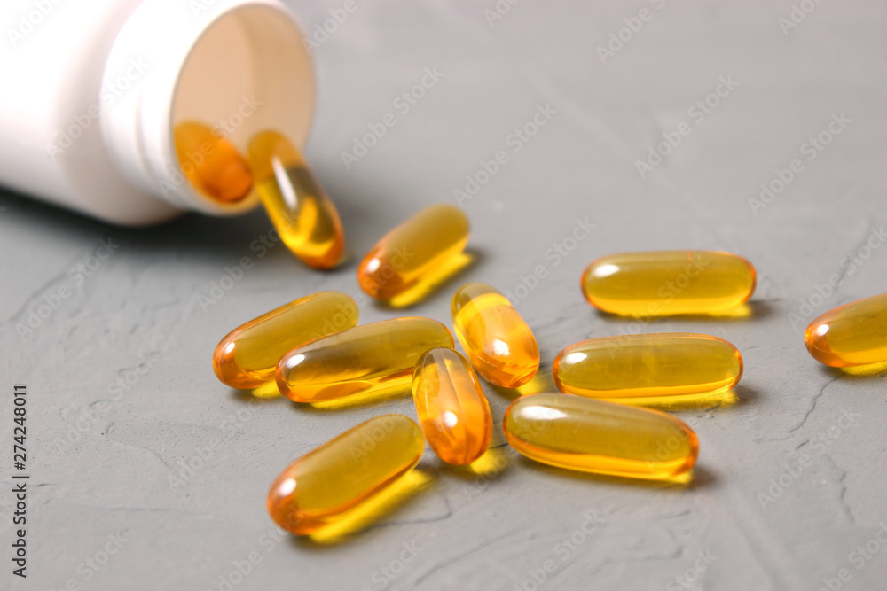 Omega-3 capsules on a colored background. Fish oil, healthy supplements Omega-3 capsules on a colored background. Fish oil, healthy supplements