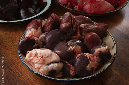 Spread out in bowls, washed, pig insides after cutting