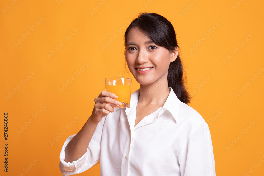 Young Asian woman drink orange juice. Young Asian woman drink orange juice.