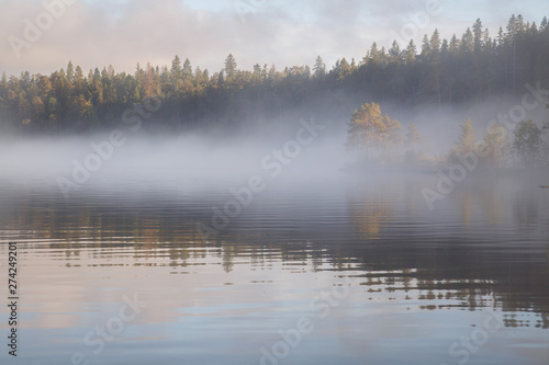 Fototapeta Naklejka Na Ścianę i Meble -  Foggy morning landscape on the lake, Valaam Island, Karelia, Russia.