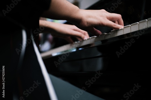 Beautiful woman playing piano, learn to play piano. © Charlie's