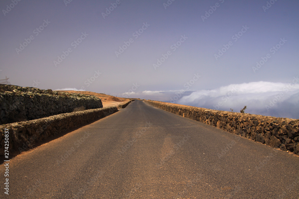 Mirador del Rio - Lanzarote: Scenic curved road on high mountain peak viewpoint above clouds