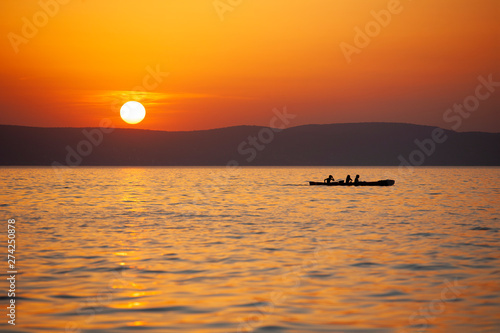 Kayaking on lake Balaton at sunset in Hungary