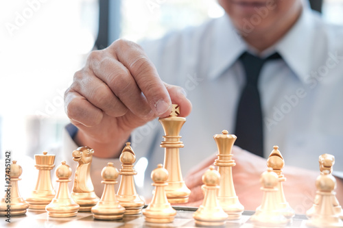 Wallpaper Mural Businessman play with chess game. success management concept of business strategy and tactic challenge. Torontodigital.ca