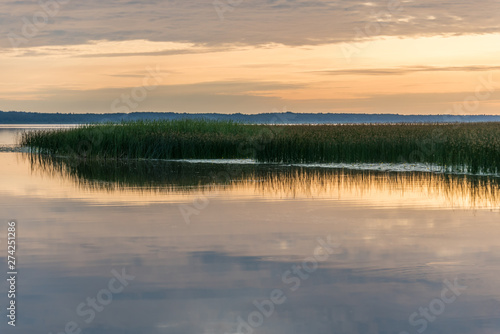 A Still Lake in Rural Latvia at Sunset