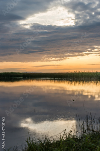 A Still Lake in Rural Latvia at Sunset