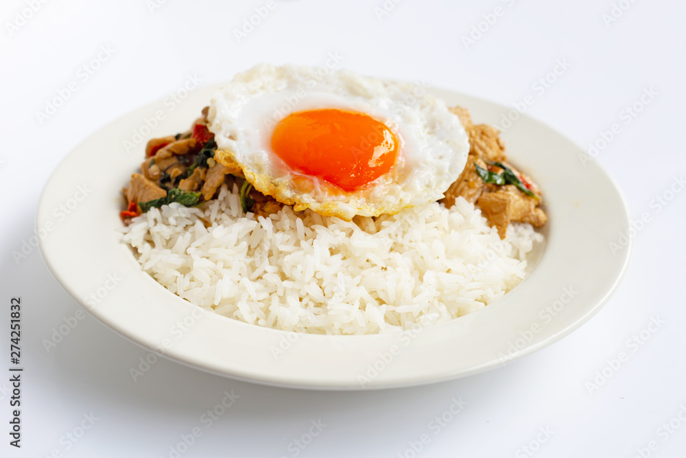 Rice topped with stir-fried chicken and holy basil, fried egg Rice topped with stir-fried chicken and holy basil, fried egg