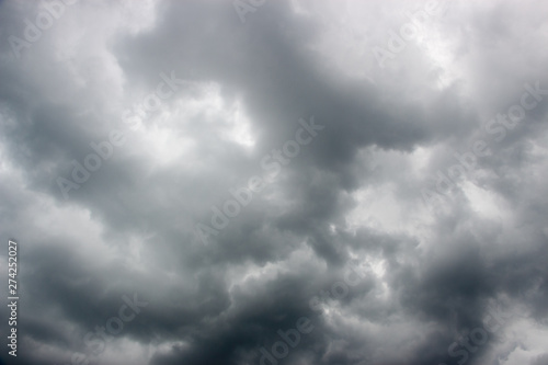 Light in the Dark and Dramatic Storm Clouds background