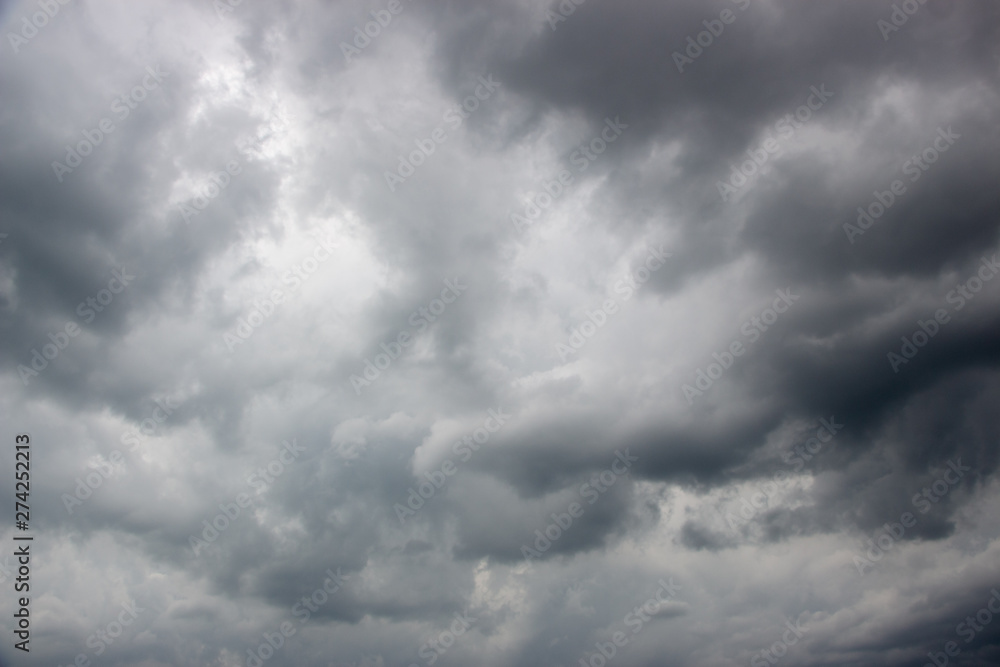 Light in the Dark and Dramatic Storm Clouds background