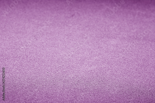 Plastic glittering texture with blur effect in purple color.