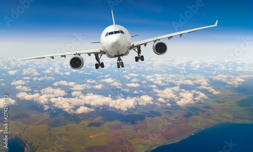 white, passenger airliner fly in sky