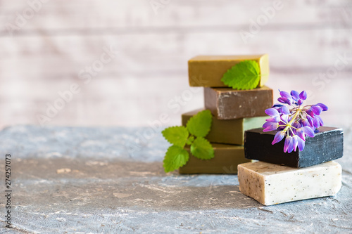 Pieces of natural soap made with your hands on the table close-up with space for text. Hobbies of modern man