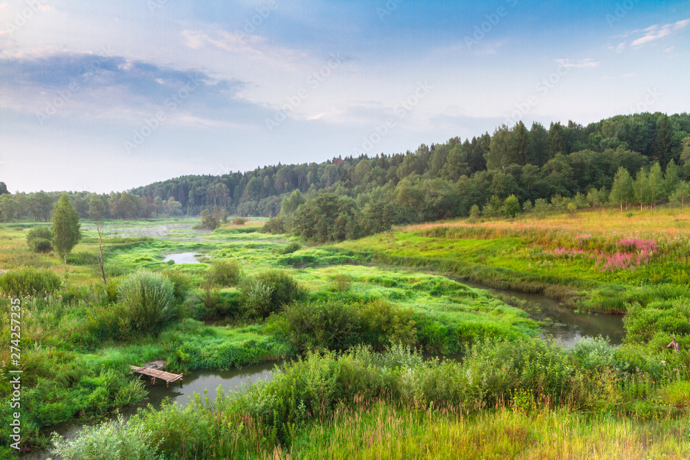 Obraz premium landscape with river and clouds at sunrise