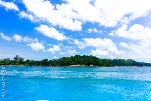 Island in the blue sea and blue sky and clouds