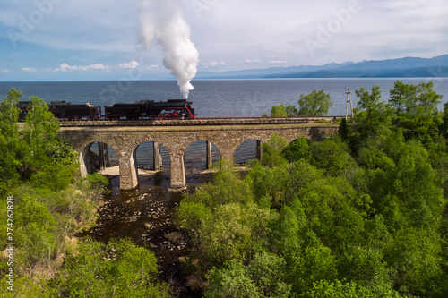 The locomotive passes over the bridge