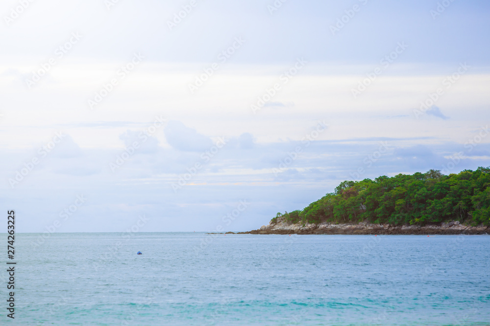 Island in the blue sea and blue sky and clouds Island in the blue sea and blue sky and clouds