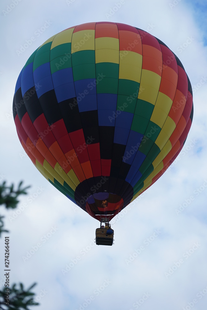 Fototapeta premium Colorful Hot Air Balloon in Cloudy Sky