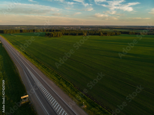 Top view of the road in summer evening. View from drone