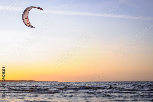 Kiteboarding on the Baltic Sea beach in Swinoujscie town, West Pomerania region of Poland © Fotokon