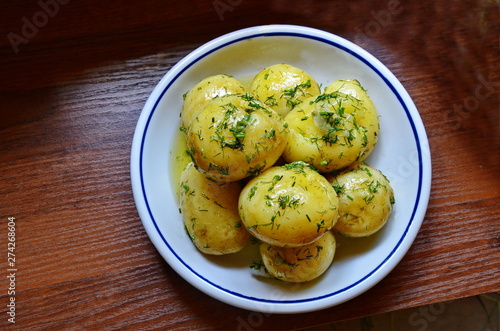 Quadro su tela Tasty potatoes are served to a table.