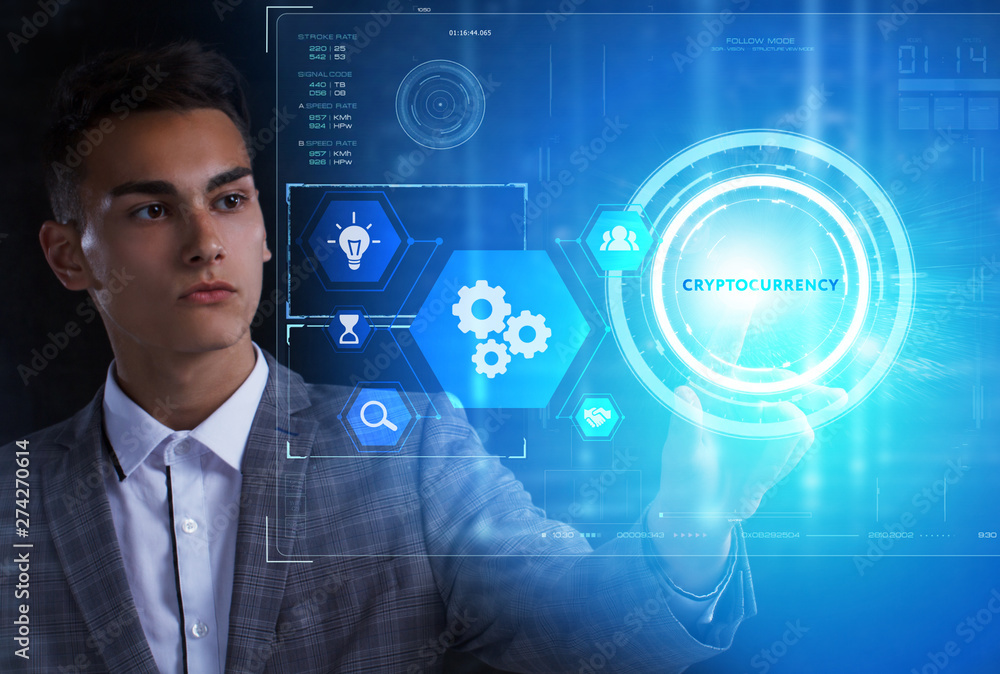 The concept of business, technology, the Internet and the network. A young entrepreneur working on a virtual screen of the future and sees the inscription: Cryptocurrency The concept of business, technology, the Internet and the network. A young entrepreneur working on a virtual screen of the future and sees the inscription: Cryptocurrency