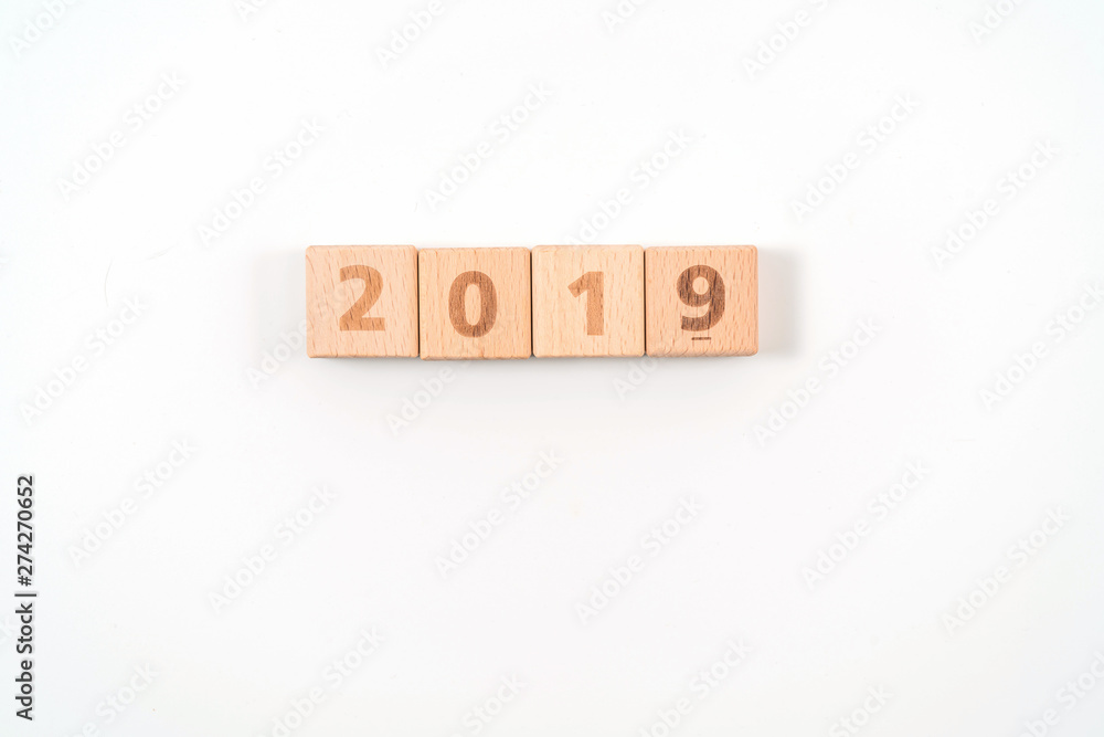 word 2019 on wood cube dices on white background. word 2019 on wood cube dices on white background.