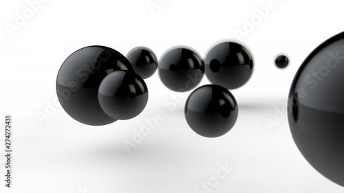 3D illustration of large and small black balls, spheres, geometric shapes isolated on a white background. Abstract, futuristic, cropped image of perfectly shaped objects. 3D rendering